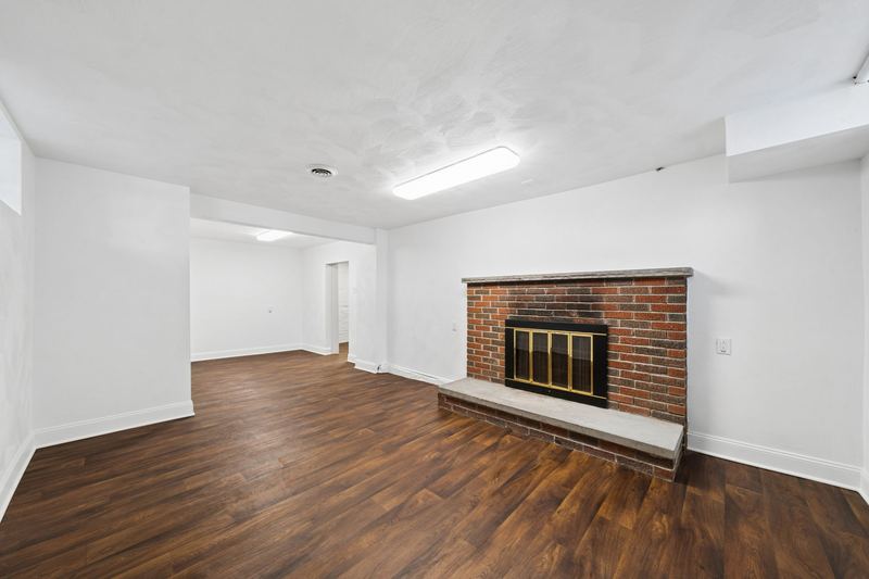 Finished basement with brick fireplace, 700 Meade Street