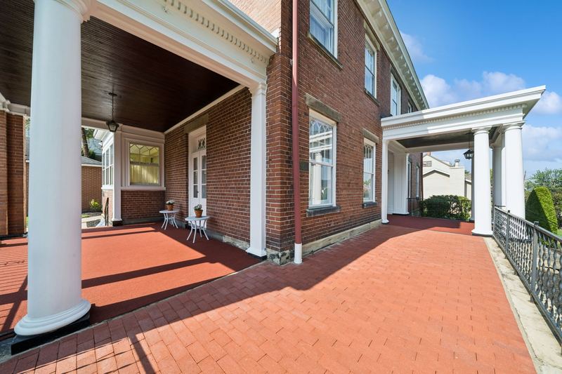 Wrap-around porch with brick floor, 700 Meade Street