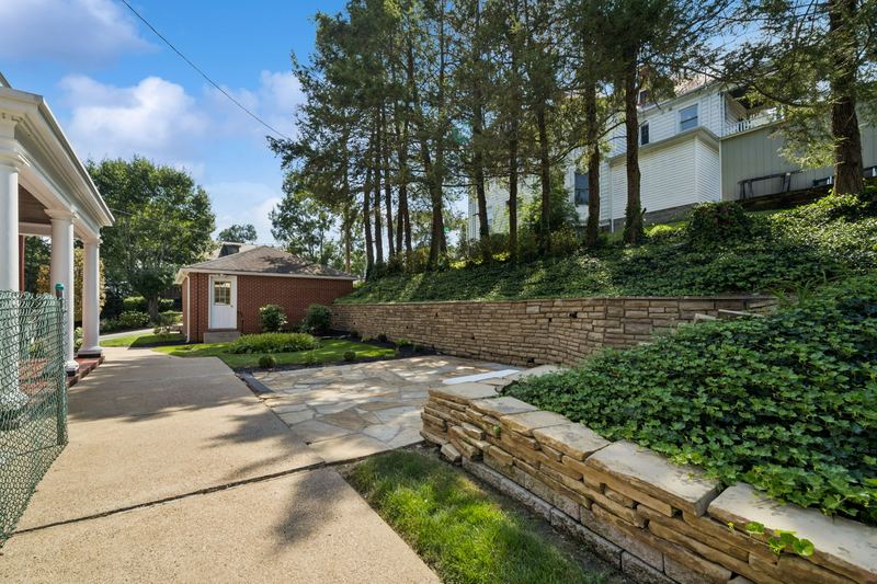 Rear grounds and stone garden walls, 700 Meade Street
